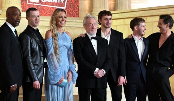 From left to right, Denzel Washington, Joseph Quinn, Connie Nielsen, Ridley Scott, Paul Mescal, Fred Hechinger, and Pedro Pascal pose on the red carpet upon arrival for the Royal film performance and World premiere of the film "Gladiator II" in London, England, on Nov. 13.