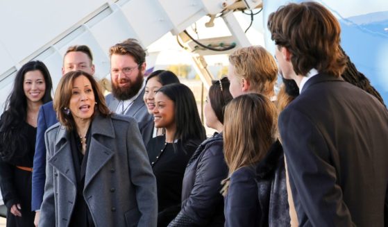 Vice President Kamala Harris talks to her campaign staff in front of Air Force Two as she prepares to depart from Harry Reid International Airport in Las Vegas, Nevada, on Friday.