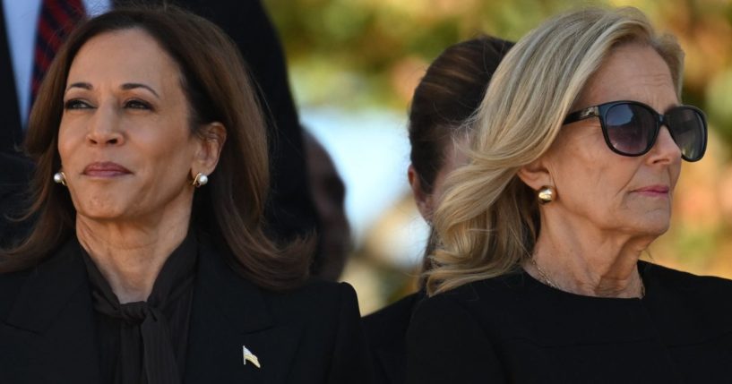 Vice President Kamala Harris, left, and first lady Jill Biden, right, listen to President Joe Biden deliver remarks at the National Veterans Day Observance at Arlington National Cemetery in Arlington, Virginia, on Monday.