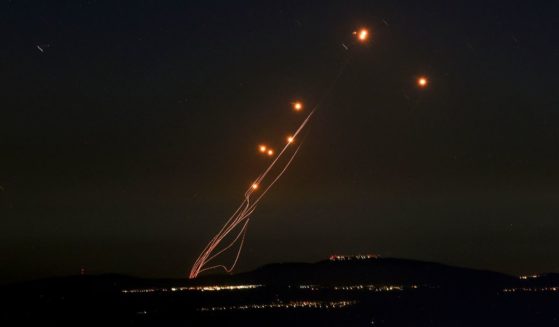 Rockets fired from southern Lebanon are intercepted by Israel's Iron Dome air defense system over the Upper Galilee region in northern Israel on Sept. 27.