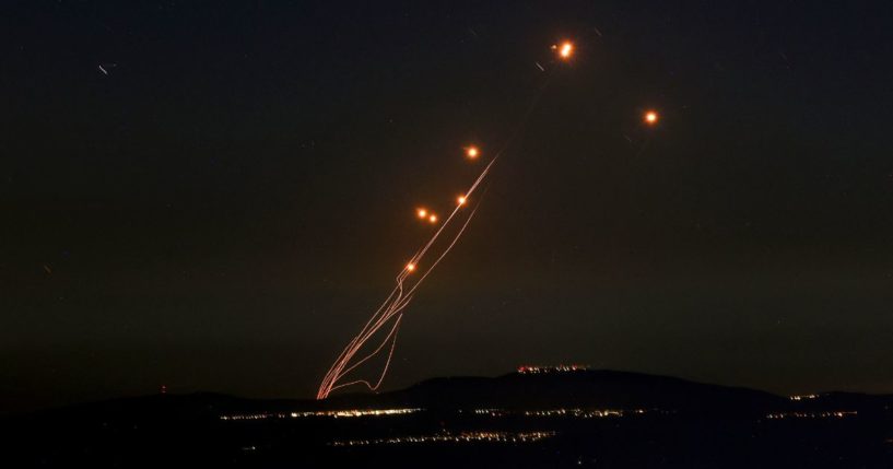 Rockets fired from southern Lebanon are intercepted by Israel's Iron Dome air defense system over the Upper Galilee region in northern Israel on Sept. 27.