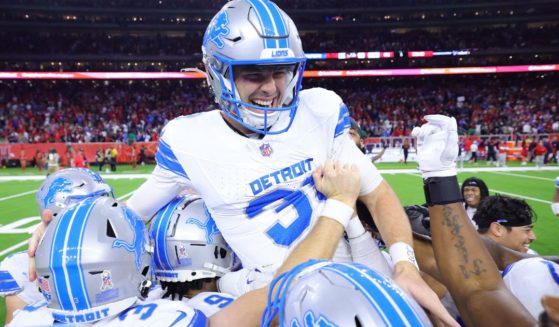 Jake Bates, center, of the Detroit Lions celebrates with teammates after kicking the winning field goal during the fourth quarter against the Houston Texans in Houston, Texas, on Sunday.