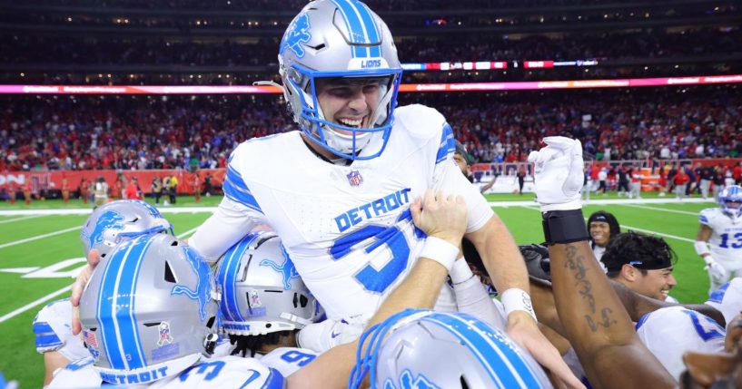 Jake Bates, center, of the Detroit Lions celebrates with teammates after kicking the winning field goal during the fourth quarter against the Houston Texans in Houston, Texas, on Sunday.