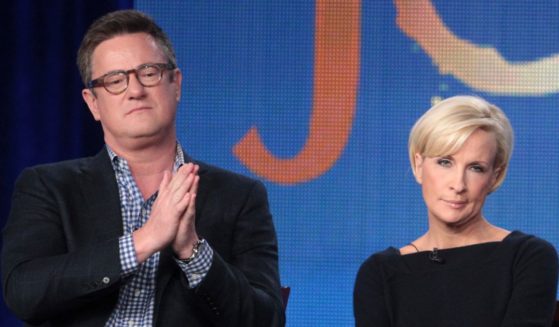 Joe Scarborough, left, and Mika Brzezinski, right, speak onstage during the "Morning Joe" panel during the 2012 Winter TCA Tour in Pasadena, California, on Jan. 7, 2012.