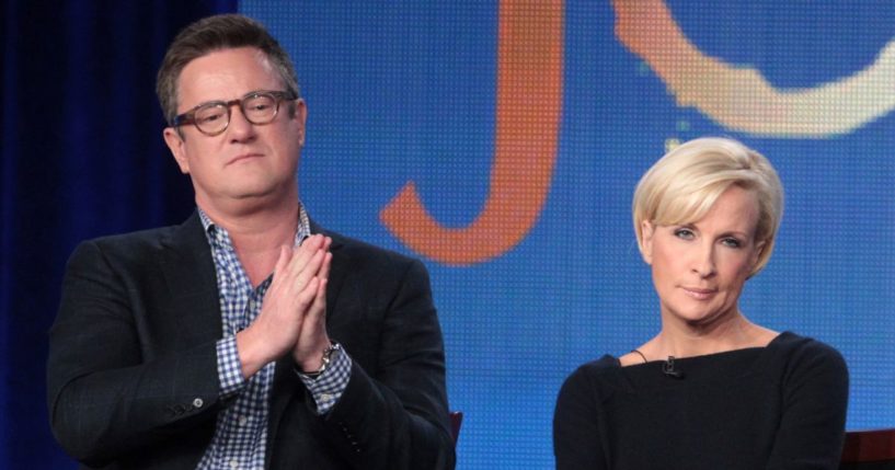 Joe Scarborough, left, and Mika Brzezinski, right, speak onstage during the 