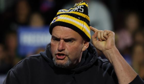 Sen. John Fetterman speaks at a campaign rally for Vice President Kamala Harris in Erie, Pennsylvania, on Oct. 14.