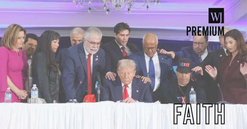 A group of people pray with former President Donald Trump during a roundtable discussion at the Latino Summit in Doral, Florida, on Oct. 22, two weeks before Trump was re-elected to the presidency.