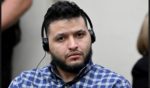 Jose Ibarra listens to an interpreter through headphones during his trial at Athens-Clarke County Superior Court Wednesday in Athens, Georgia.