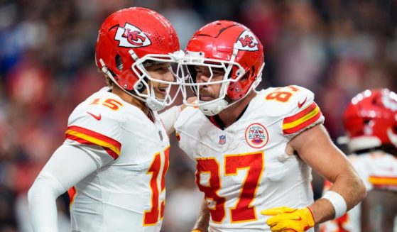 Kansas City Chiefs quarterback Patrick Mahomes, left, and tight end Travis Kelce, right, celebrate after a touchdown during the second quarter of an NFL football game against the Las Vegas Raiders in Las Vegas, Nevada, on Oct. 27.