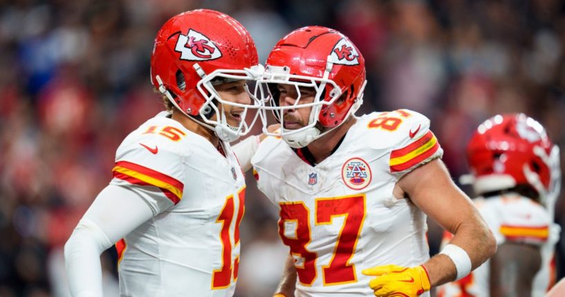 Kansas City Chiefs quarterback Patrick Mahomes, left, and tight end Travis Kelce, right, celebrate after a touchdown during the second quarter of an NFL football game against the Las Vegas Raiders in Las Vegas, Nevada, on Oct. 27.