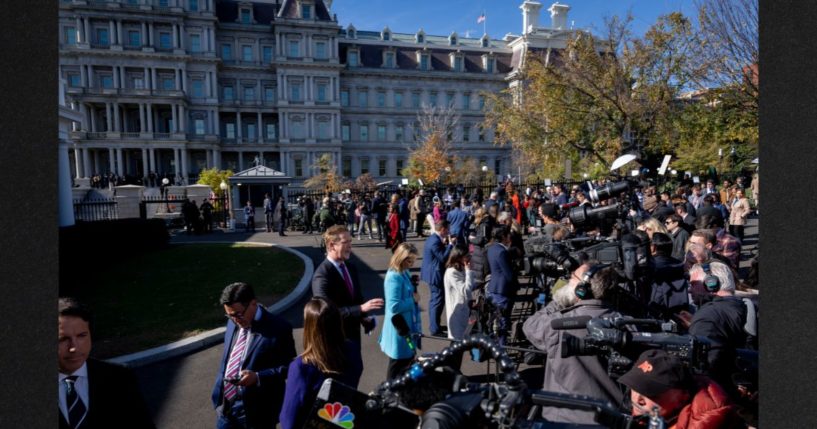 Members of the press gather outside the West Wing of the White House, with Biden employees outside the Eisenhower Executive Office in the background, as President Joe Biden met with President-elect Donald Trump in the Oval Office Wednesday.