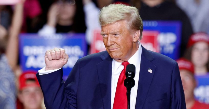 Now-President-elect Donald Trump pumps his fist at a rally in Grand Rapids, Michigan, on Nov. 5, 2024.