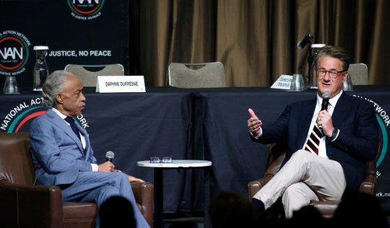 Rev. Al Sharpton sitting next to Joe Scarborough at the National Action Network's Empowerment Luncheon on April 11, 2024.