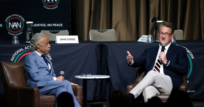 Rev. Al Sharpton sitting next to Joe Scarborough at the National Action Network's Empowerment Luncheon on April 11, 2024.