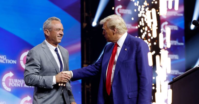 President-elect Donald Trump shakes the hand of Robert F. Kennedy Jr. at a Turning Point even in Duluth, Georgia, on Oct. 23.