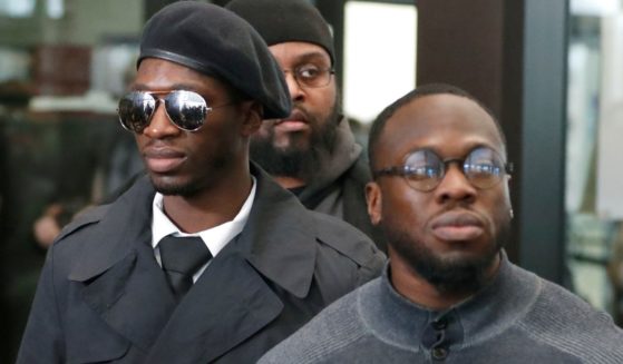 Olabinjo and Abimbola Osundairo stand outside the Leighton Criminal Courthouse on Feb. 24, 2020.