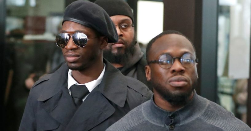 Olabinjo and Abimbola Osundairo stand outside the Leighton Criminal Courthouse on Feb. 24, 2020.