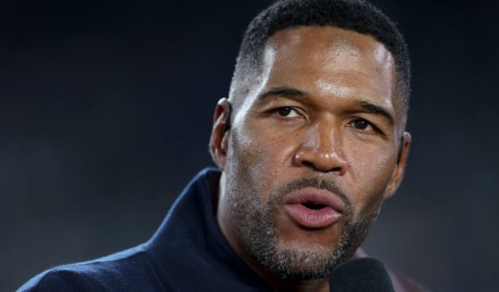 Sports analyst Michael Strahan talks prior to the game between the New York Giants and the Dallas Cowboys in East Rutherford, New Jersey, on Sept. 26.