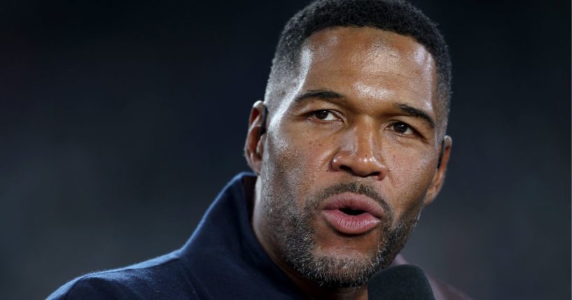 Sports analyst Michael Strahan talks prior to the game between the New York Giants and the Dallas Cowboys in East Rutherford, New Jersey, on Sept. 26.