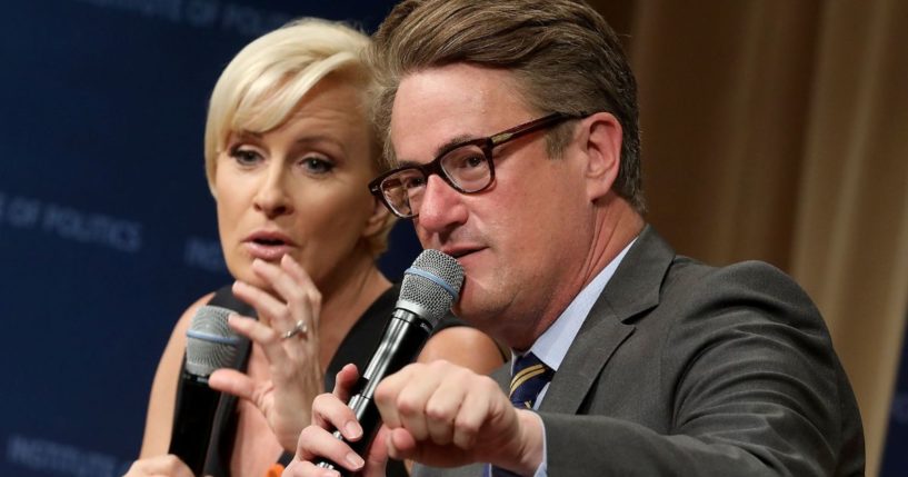 Joe Scarborough, right, and Mika Brzezinski, left, are interviewed by philanthropist and financier David Rubenstein during a Harvard Kennedy School Institute of Politics event in Washington, D.C., on July 12, 2017.