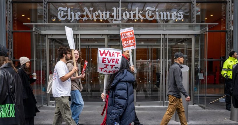 Members of The New York Times Tech Guild protest outside of the New York Times headquarters building in New York City on Monday.