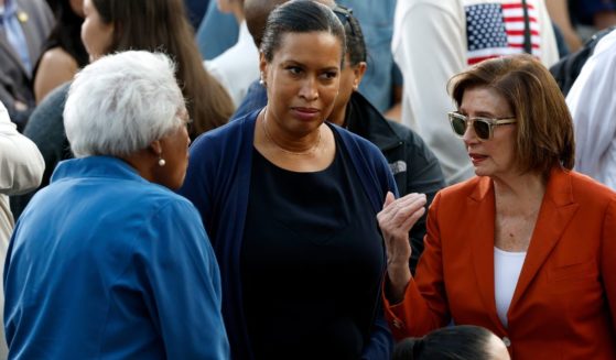 Rep. Nancy Pelosi, right, speaks with Washington D.C. Mayor Muriel Bowser, center, and Donna Brazile, left, before Vice President Kamala Harris' concession speech at Howard University in Washington, D.C., on Wednesday.