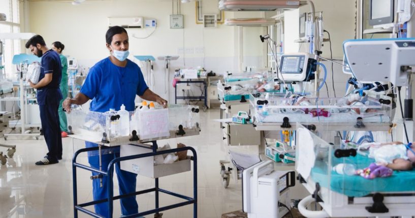 A nurse checks the health of newborn babies in the neonatal intensive care unit at Rajnidera hospital on April 11, 2023 in Patiala, India.