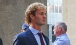 Daniel Penny (R), who is charged in the death of Jordan Neely, walks into the courthouse as jury selection begins in his trial on October 21, 2024 in New York City.