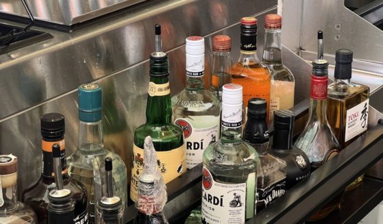 View from behind a bar counter with various liquor bottles and bar tools at a restaurant, Bishop Ranch Business Park, San Ramon, California, May 22, 2024.