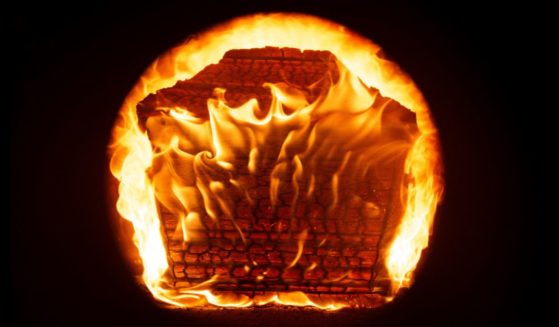 This photograph shows a casket buring during a cremation at a funeral centre in Mulhouse, eastern France, on October 18, 2024.