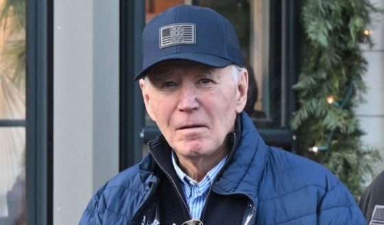 US President Joe Biden holds the book "The Hundred Years' War on Palestine" by Rashid Khalidi as he walks out of Nantucket Bookworks in Nantucket, Massachusetts, on November 29, 2024.