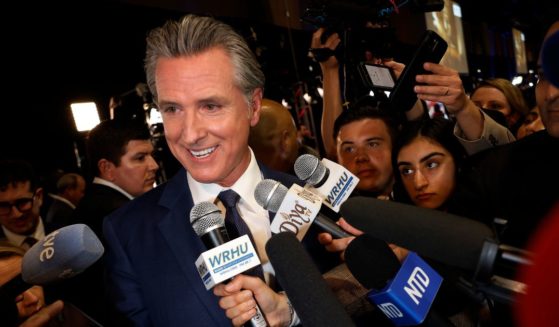 California Governor Gavin Newsom talks to journalists in the media center at the Pennsylvania Convention Center before the first presidential debate between Republican presidential nominee, former President Donald Trump and Democratic presidential nominee, U.S. Vice President Kamala Harris on September 10, 2024 in Philadelphia, Pennsylvania.