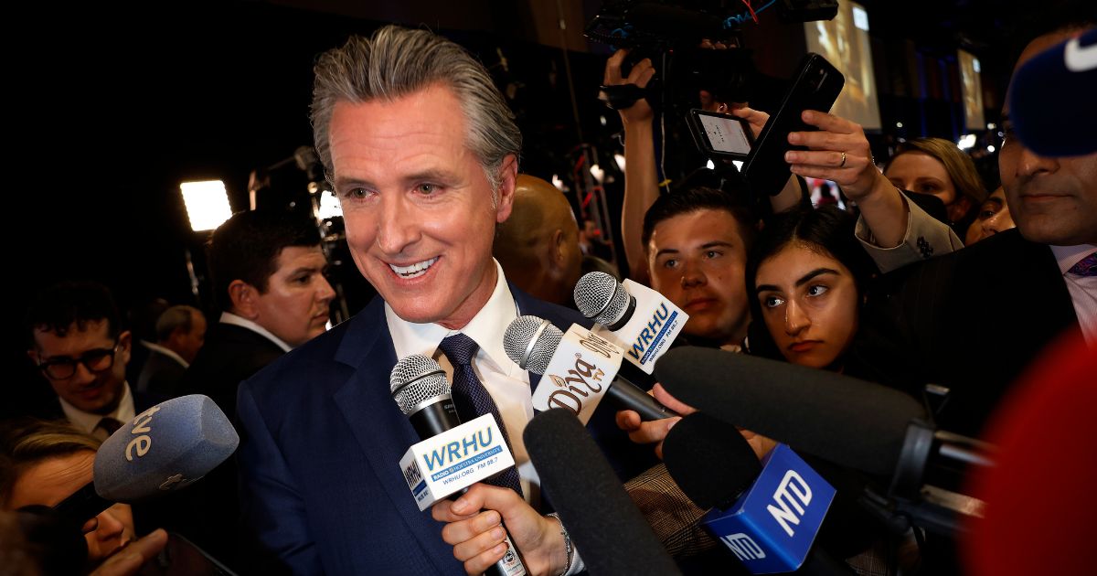 California Governor Gavin Newsom talks to journalists in the media center at the Pennsylvania Convention Center before the first presidential debate between Republican presidential nominee, former President Donald Trump and Democratic presidential nominee, U.S. Vice President Kamala Harris on September 10, 2024 in Philadelphia, Pennsylvania.