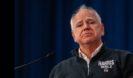 Democratic vice presidential nominee, Minnesota Gov. Tim Walz, speaks at a rally to kick off his "Driving Forward" Blue Wall Bus Tour at the KI convention center on October 14, 2024 in Green Bay, Wisconsin. Walz is joined by Wisconsin Governor Tony Evers and Michigan Governor Gretchen Whitmer at the rally.