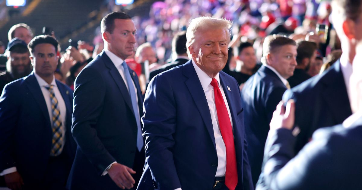 Surrounded by U.S. Secret Service agents, Republican presidential nominee, former President Donald Trump leaves the the Santander Arena following a campaign rally on November 04, 2024 in Reading, Pennsylvania.