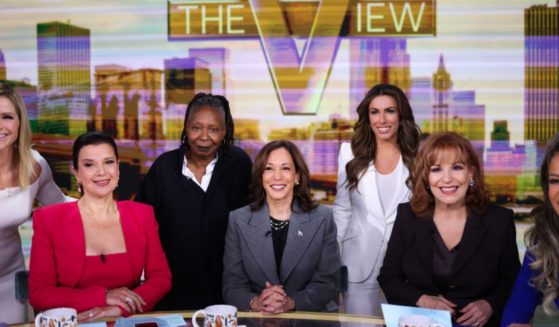 Co-hosts of "The View" pose for a photo with Vice President Kamala Harris, center, when she recorded the show in New York City on Oct. 8.