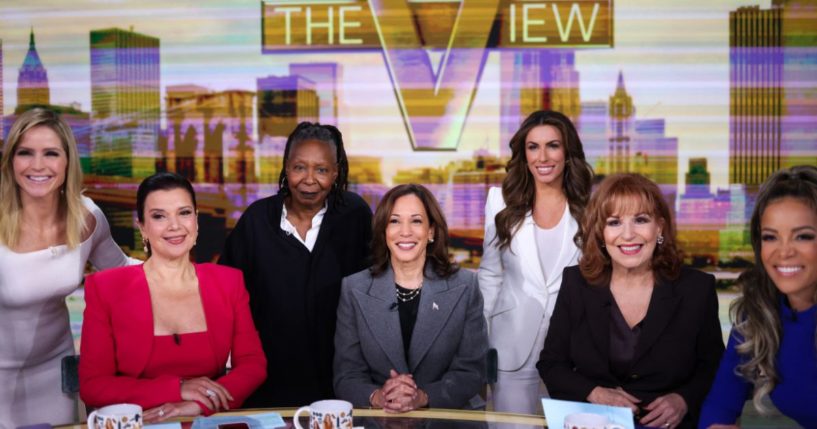 Co-hosts of "The View" pose for a photo with Vice President Kamala Harris, center, when she recorded the show in New York City on Oct. 8.