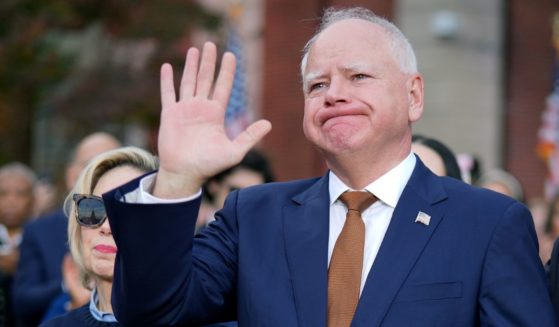 Minnesota Gov. Tim Walz, the 2024 Democratic vice presidential nominee, reacts after Vice President Kamala Harris conceded the election in a speech at Howard University Wednesday in Washington, D.C.