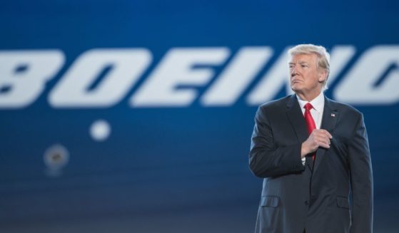 Then-President Donald Trump waits to address the crowd during the debut event for the Dreamliner 787-10 at Boeing's South Carolina facilities in North Charleston, South Carolina, on Feb. 17, 2017.