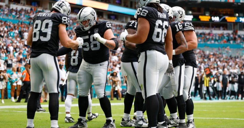 Brock Bowers, left, of the Las Vegas Raiders celebrates a touchdown by performing the "Trump Dance" with fellow teammates.