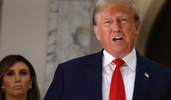 Lawyer Alina Habba, left, looks on as former President Donald Trump, right, speaks to the media during the third day of his civil fraud trial in New York City on Oct. 4, 2023.