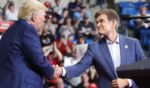 Dr. Mehmet Oz, right, is greeted by former president Donald Trump, left, at a rally in Wilkes-Barre, Pennsylvania, on Sept. 3, 2022.