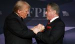 President-elect Donald Trump, left, greets actor Sylvester Stallone, right, onstage at the America First Policy Institute Gala in Palm Beach, Florida, on Thursday.