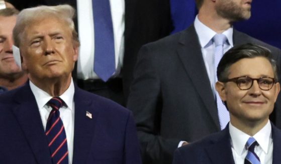 Former President Donald Trump stands with Speaker of the House Mike Johnson of Louisiana at the Republican National Convention on July 17 in Milwaukee, Wisconsin.