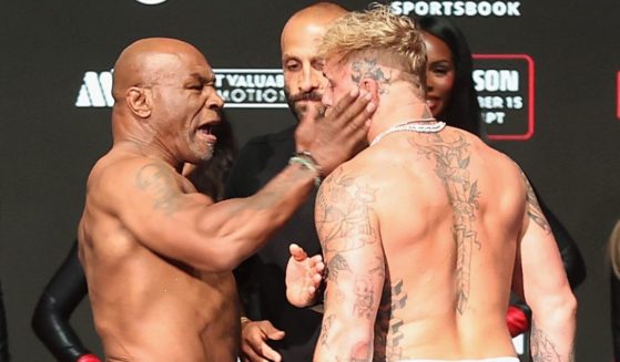 Legendary boxer Mike Tyson, left, struck opponent Jake Paul, right, during a weigh in ceremony in Irving, Texas, on Thursday.