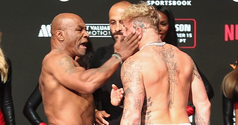 Legendary boxer Mike Tyson, left, struck opponent Jake Paul, right, during a weigh in ceremony in Irving, Texas, on Thursday.