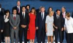 African Union Chair Egyptian President Abdel Fattah el-Sisi, Japanese Prime Minister's wife Akie Abe, Japan's Prime Minister Shinzo Abe, Canada's Prime Minister Justin Trudeau, US First Lady Melania Trump, US President Donald Trump, French President's wife Brigitte Macron, France's President Emmanuel Macron and Germany's Chancellor Angela Merkel join G7 leaders and guests as they gather for a family picture in front of the Biarritz lighthouse on the second day of the annual G7 summit on August 25, 2019 in Biarritz, France.