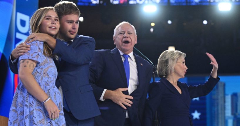 Gov. Tim Walz, second from right, stands with wife Gwen Walz, right, and children Gus Walz, second from left, and Hope Walz, left, after speaking on the third day of the Democratic National Convention in Chicago, Illinois, on Aug. 20.