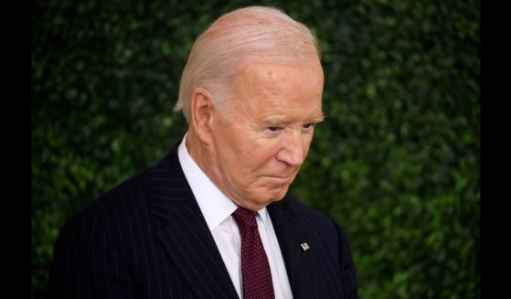 U.S. President Joe Biden listens to first lady Jill Biden speak during the Classroom to Career Summit in the East Room of the White House on November 13, 2024 in Washington, DC.