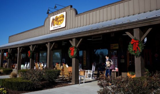 Exterior of Cracker Barrel with homey touches and rocking chairs photographed in Sterling, Virginia.